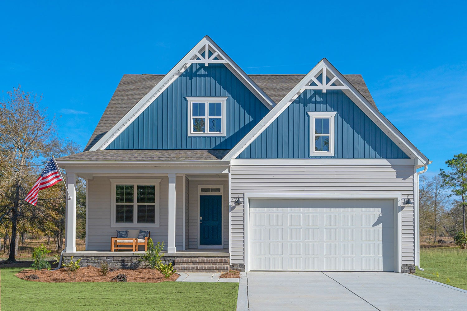 Beautiful Southern coastal home with blue and white vinyl siding